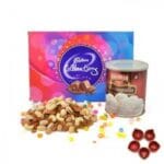 Mouth Watering Combo Of Goodies with Diya